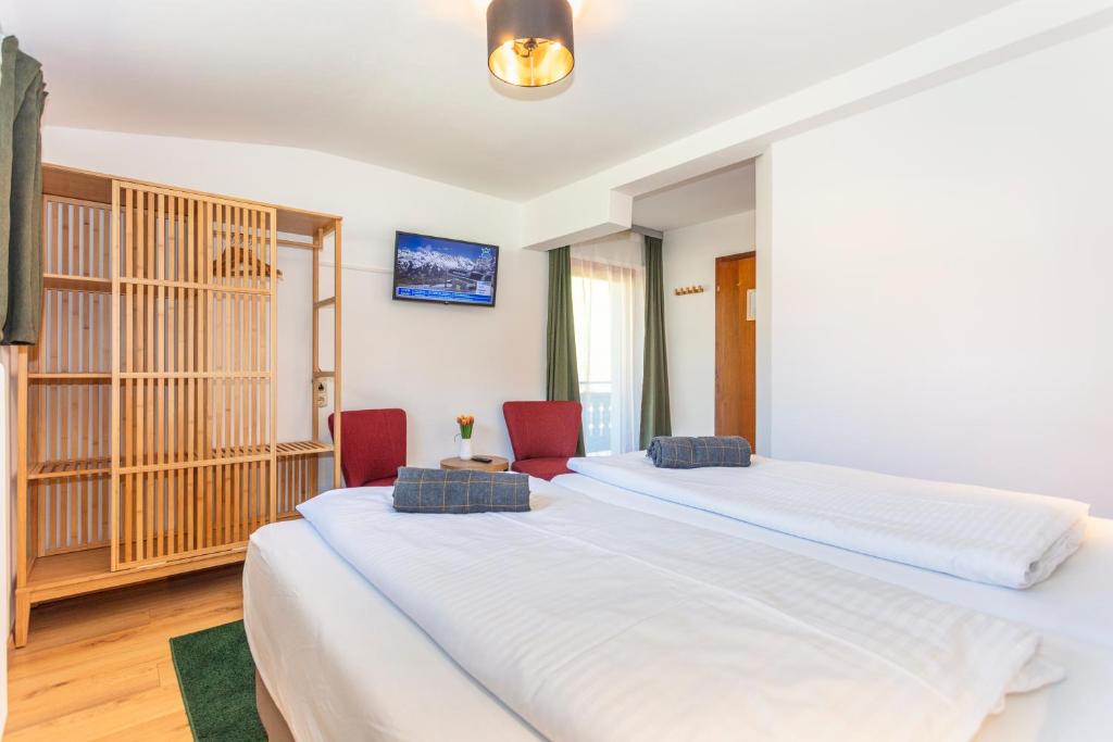 Postel nebo postele na pokoji v ubytování Sonnberg Lodge