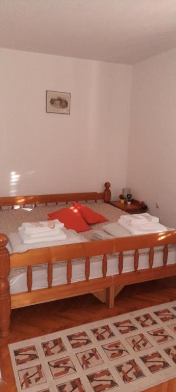 Postel nebo postele na pokoji v ubytování Apartman Domacinstvo La ViE na selu