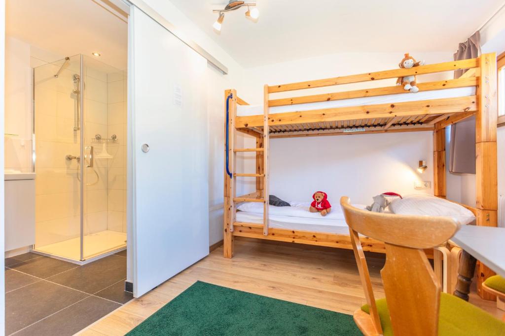 Postel nebo postele na pokoji v ubytování Sonnberg Lodge