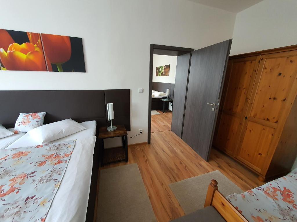 Postel nebo postele na pokoji v ubytování Apartmá na Hané