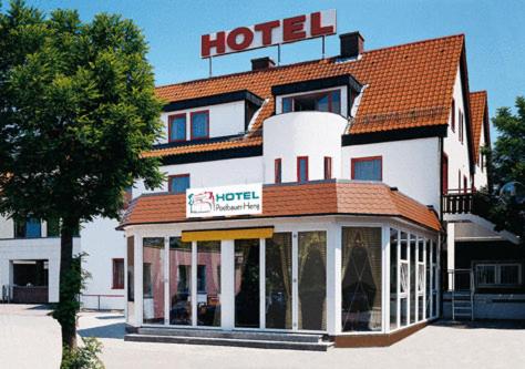 a hotel with a sign on top of it at Hotel Postbauer-Heng, E-Mobilität, Ladestationen für Elektroautos in Postbauer-Heng