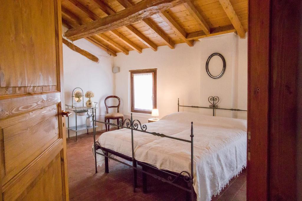 En eller flere senge i et værelse på Agriturismo Corte Galvagnina