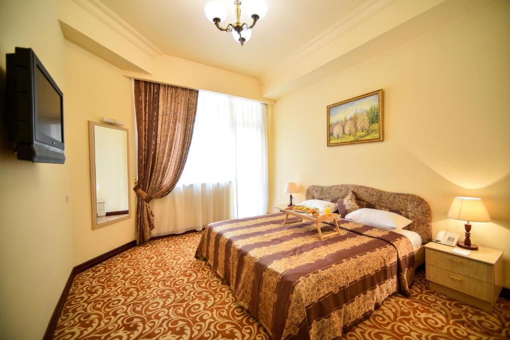 Postel nebo postele na pokoji v ubytování METROPOL HOTEL Yerevan