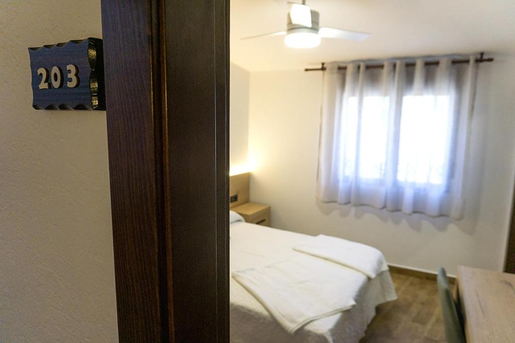 A bed or beds in a room at Alojamientos Rurales Entre Rocas