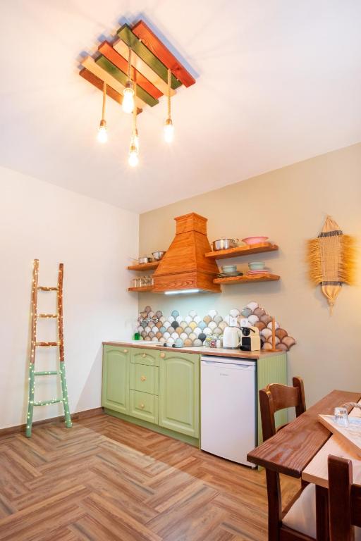 Kuchyň nebo kuchyňský kout v ubytování Gorgona Blue Apartments