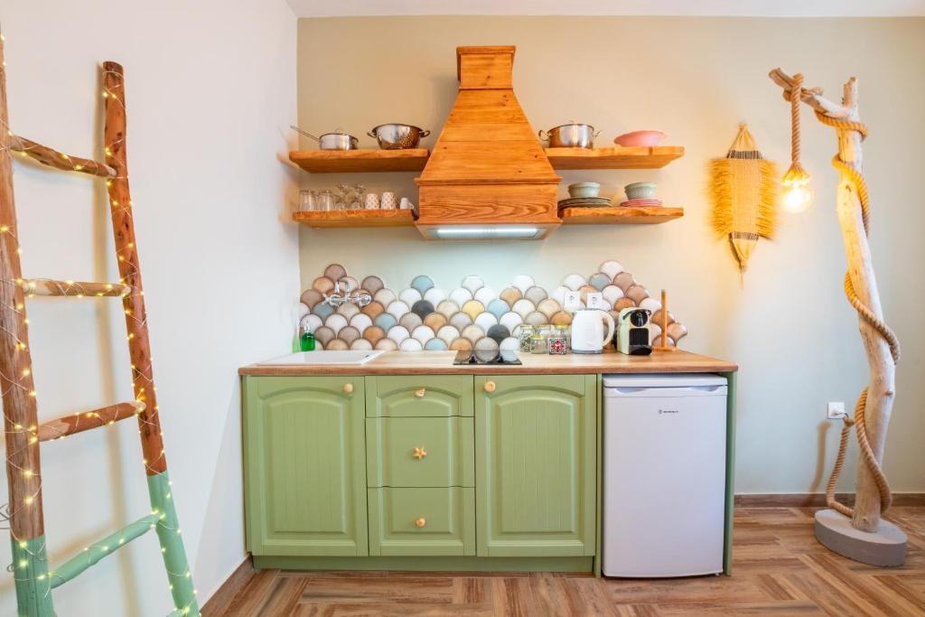 Kuchyň nebo kuchyňský kout v ubytování Gorgona Blue Apartments