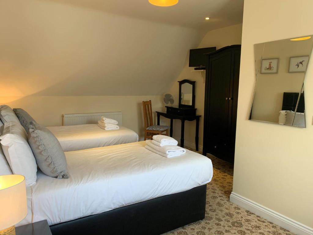 Postel nebo postele na pokoji v ubytování New Inn - Dorchester