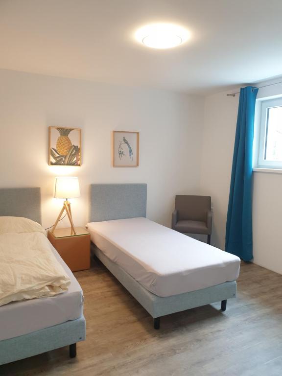 Postel nebo postele na pokoji v ubytování Workers Appartements Kreuzwirt