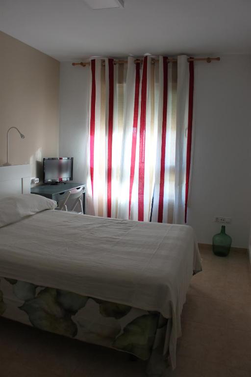 Posteľ alebo postele v izbe v ubytovaní APARTAMENTO LAS PALMERILLAS-RESIDENCIAL TORREQUEBRADA