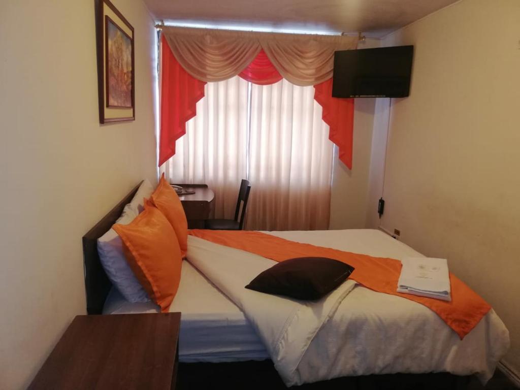 Postel nebo postele na pokoji v ubytování Hotel Bonaventure