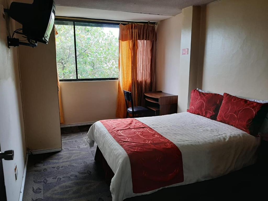 Postel nebo postele na pokoji v ubytování Hotel Bonaventure
