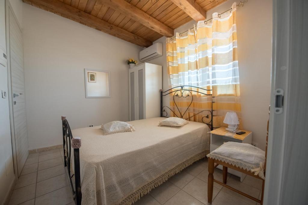Postel nebo postele na pokoji v ubytování templi la piscina