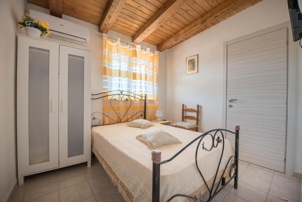 Postel nebo postele na pokoji v ubytování templi la piscina