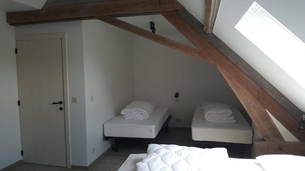 Postel nebo postele na pokoji v ubytování Vakantiewoning onZENhof