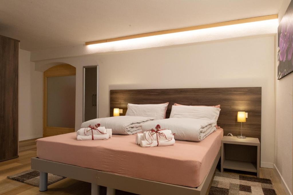 En eller flere senge i et værelse på L' aurora