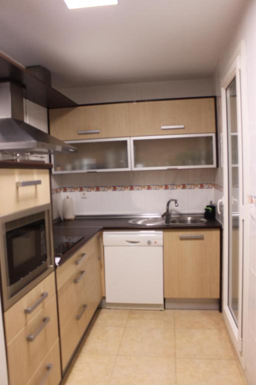 Kuchyňa alebo kuchynka v ubytovaní APARTAMENTO LAS PALMERILLAS-RESIDENCIAL TORREQUEBRADA