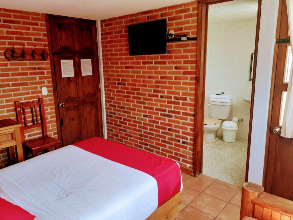 Postel nebo postele na pokoji v ubytování Hotel Bello Amanecer