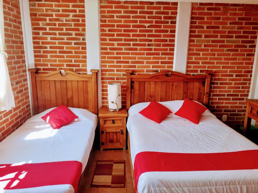 Postel nebo postele na pokoji v ubytování Hotel Bello Amanecer