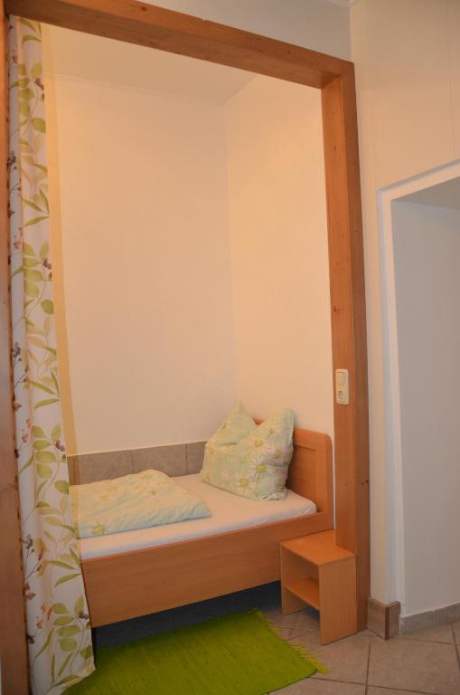 A bed or beds in a room at Ferienwohnung Vonwald