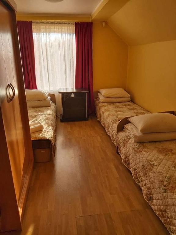 Postel nebo postele na pokoji v ubytování Vila Giruliai