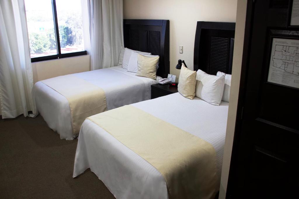Postel nebo postele na pokoji v ubytování Best Western Real Tula Express