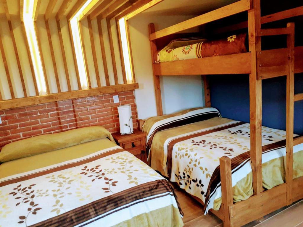 Postel nebo postele na pokoji v ubytování Hotel Bello Amanecer