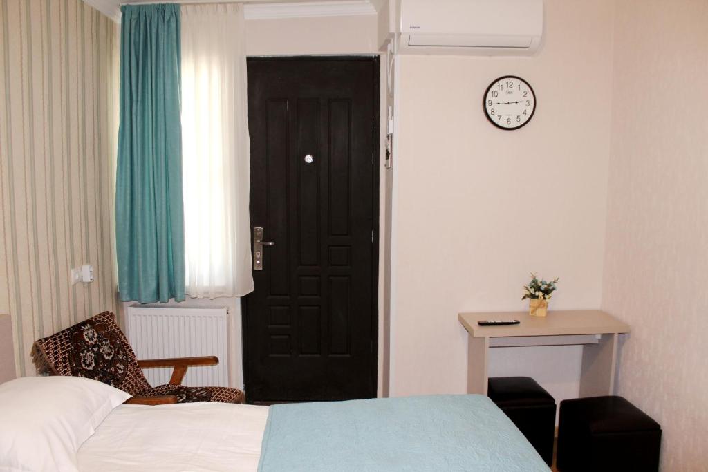 Postel nebo postele na pokoji v ubytování Guest House Old Tiflis 5