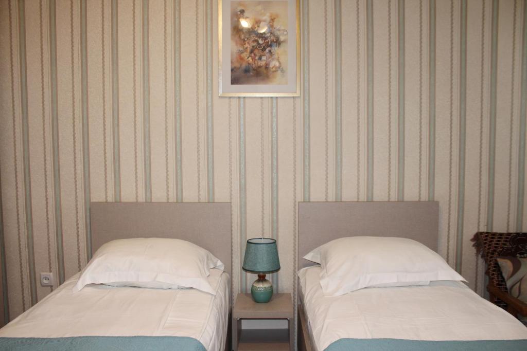 Postel nebo postele na pokoji v ubytování Guest House Old Tiflis 5