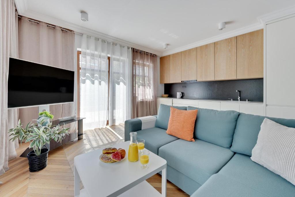Televízia a/alebo spoločenská miestnosť v ubytovaní Ocean Mint - Apartamenty przy plaży