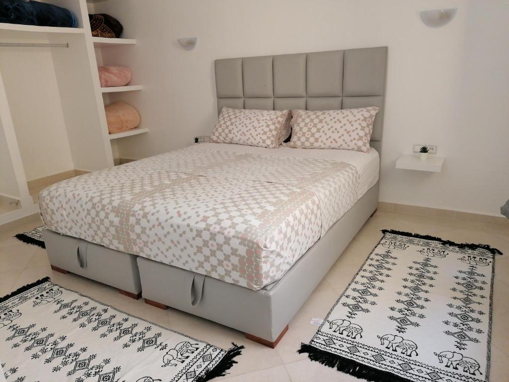 Кровать или кровати в номере Zak appartement (calme confortable et bien situé)