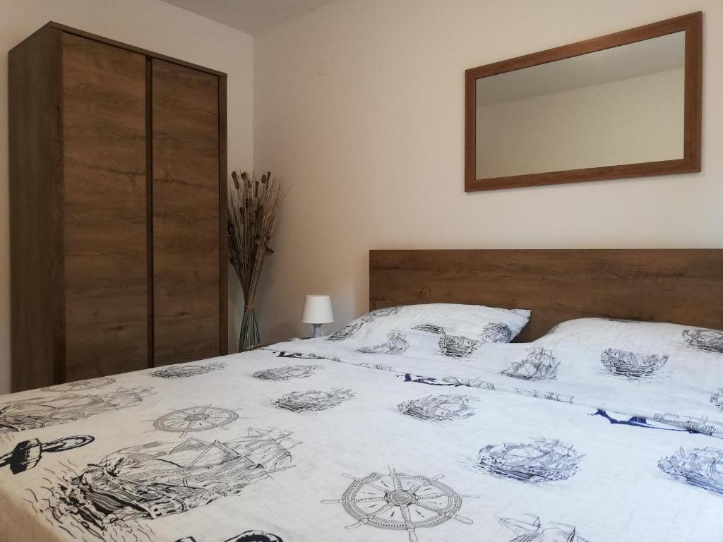 Postel nebo postele na pokoji v ubytování APARTMENT SANJA
