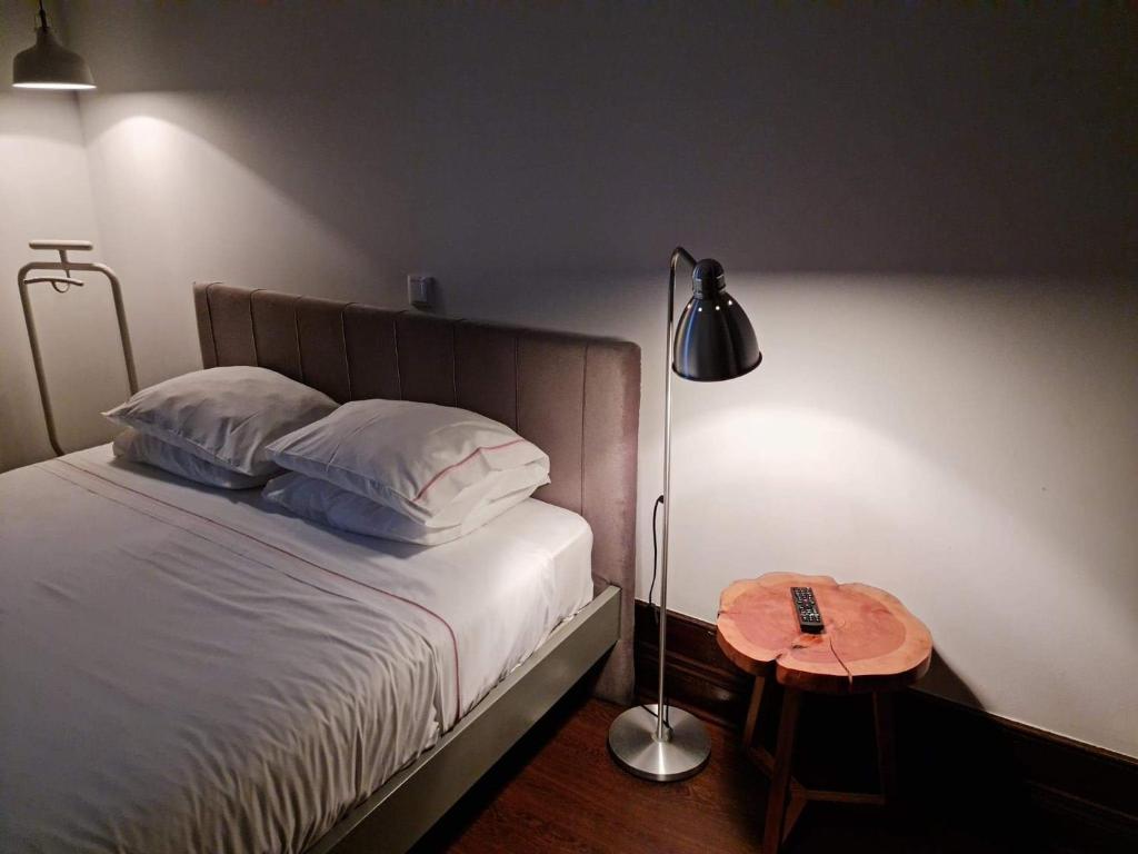 Uma cama ou camas num quarto em Rosa Biscoito Suites