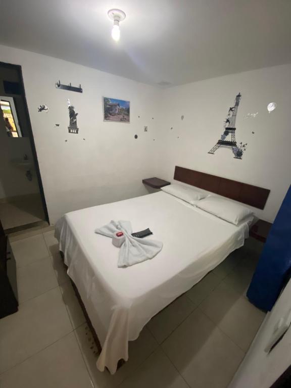 Postel nebo postele na pokoji v ubytování Hotel Policarpa