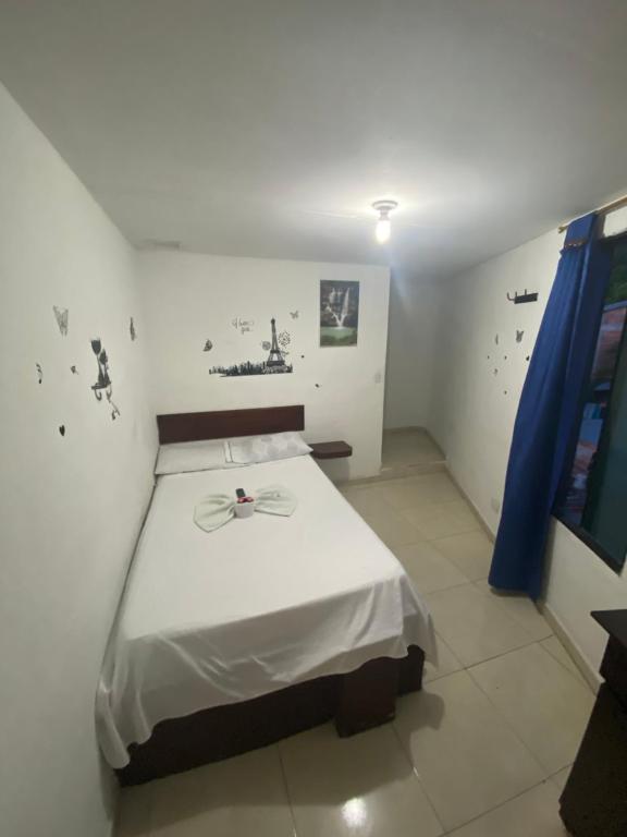 Postel nebo postele na pokoji v ubytování Hotel Policarpa