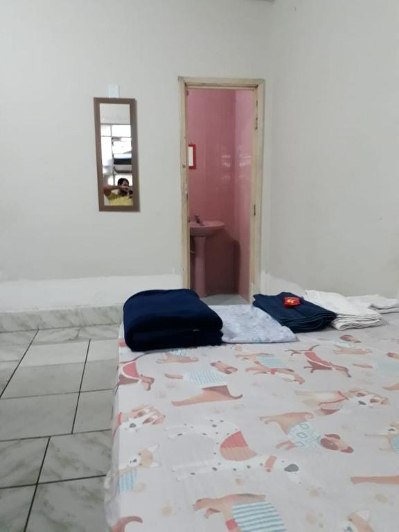 Postel nebo postele na pokoji v ubytování Kitnet BH