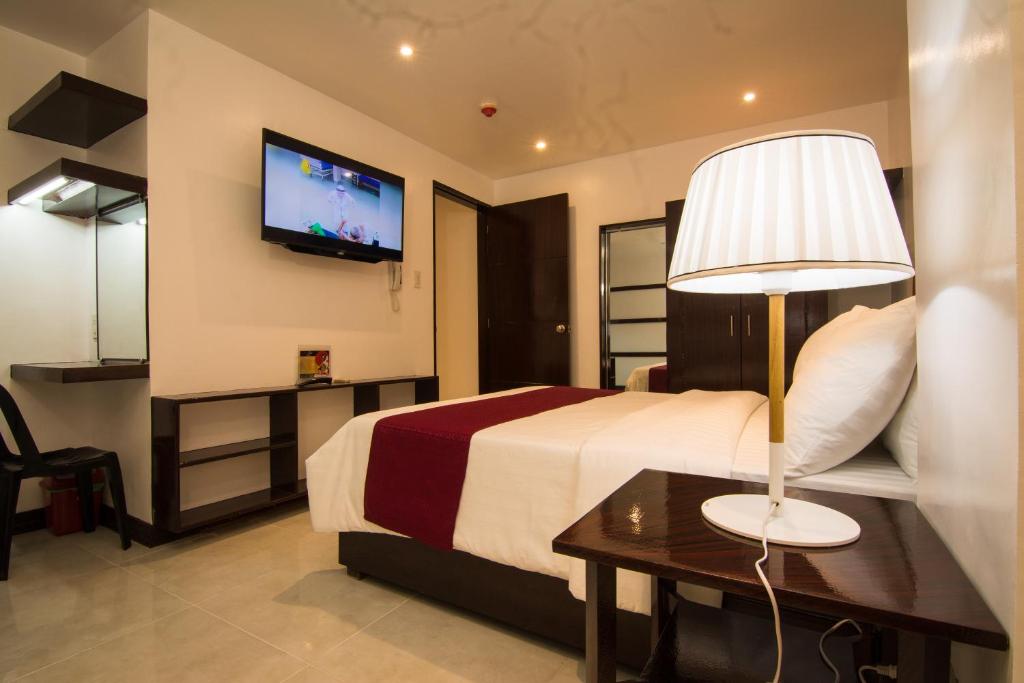 TV a/nebo společenská místnost v ubytování Diamond Hotel And Resto