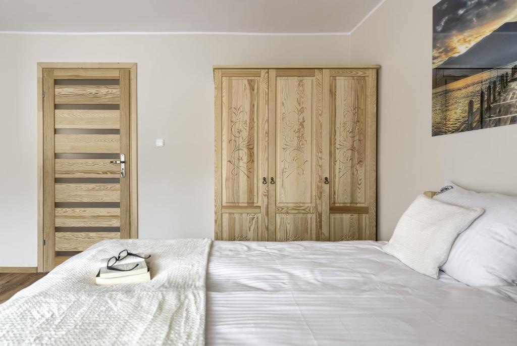 Posteľ alebo postele v izbe v ubytovaní Apartamenty VILLA SKI-BÓWKI