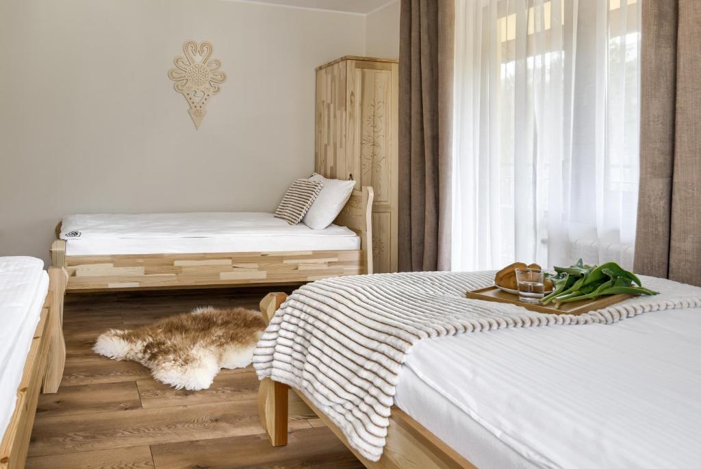 Posteľ alebo postele v izbe v ubytovaní Apartamenty VILLA SKI-BÓWKI