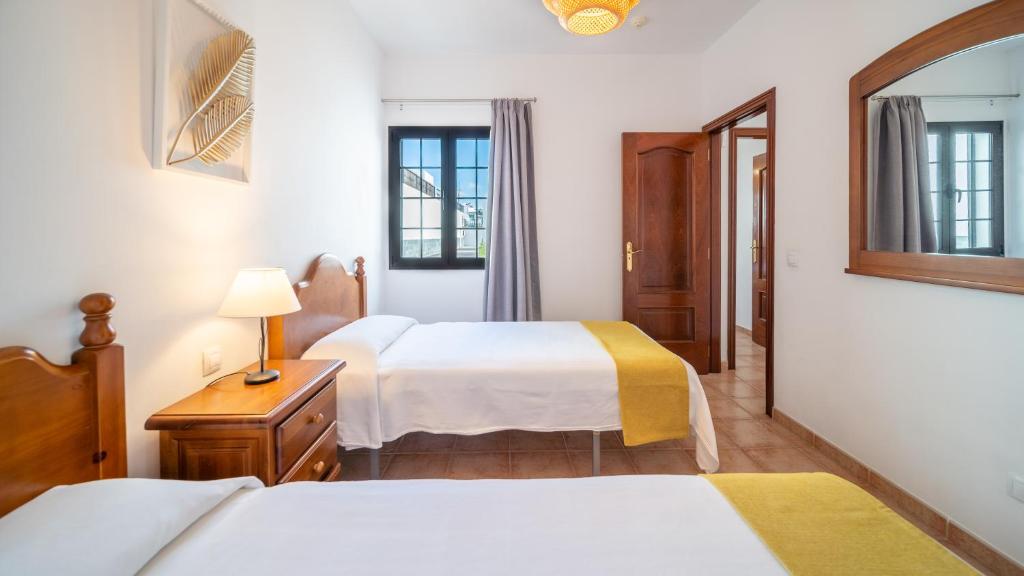 Postel nebo postele na pokoji v ubytování Villas Salinas de Matagorda