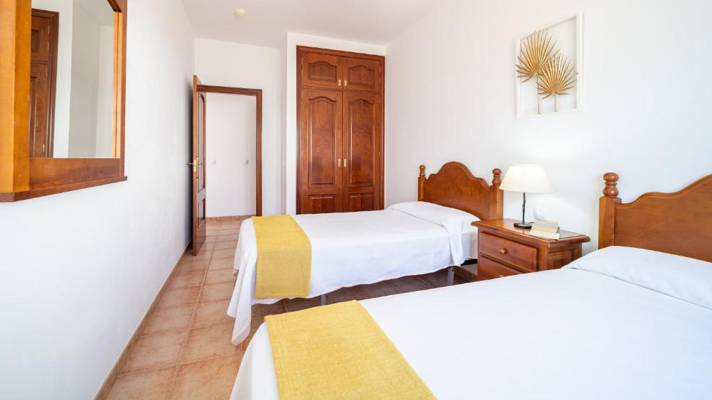 Postel nebo postele na pokoji v ubytování Villas Salinas de Matagorda
