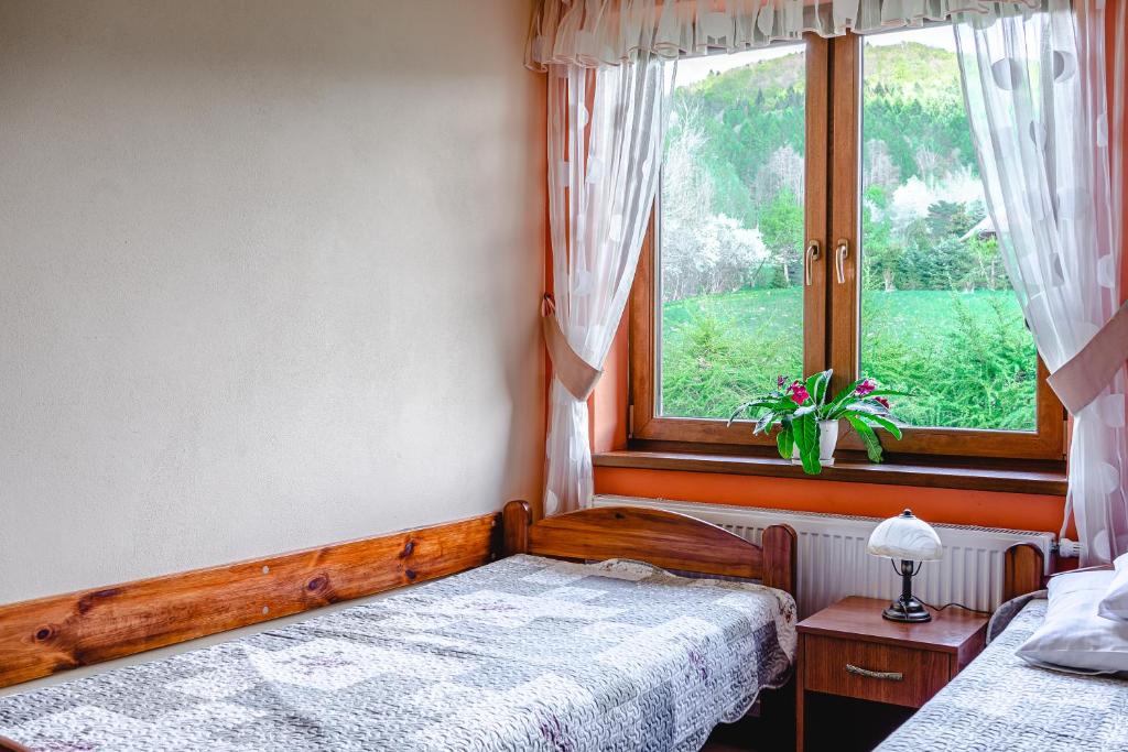 Posteľ alebo postele v izbe v ubytovaní Pokoje Gościnne Pod Wysotą