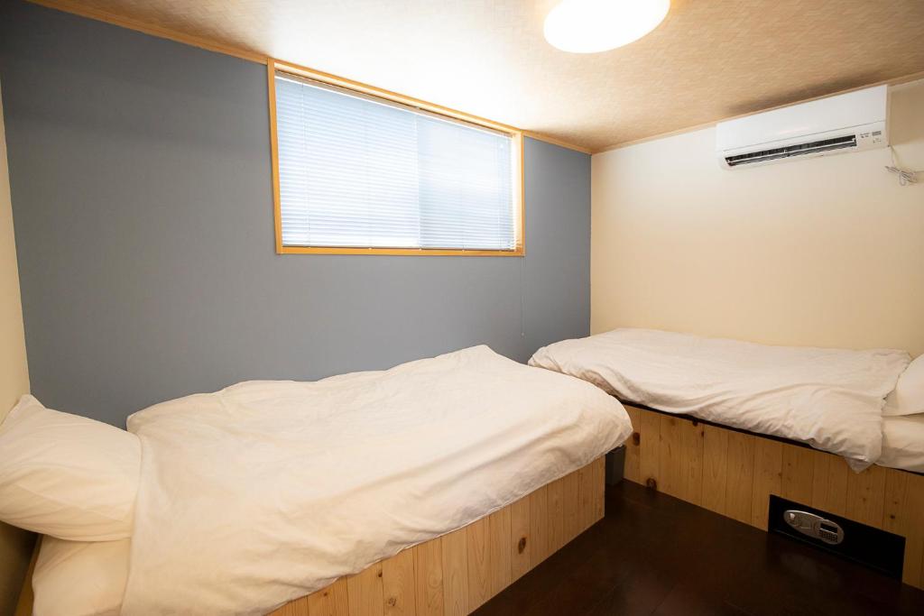 Postel nebo postele na pokoji v ubytování Guest House POST INN
