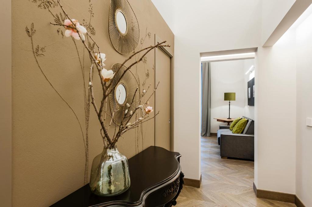 A bed or beds in a room at Ferrini Home - Etnea Portrait