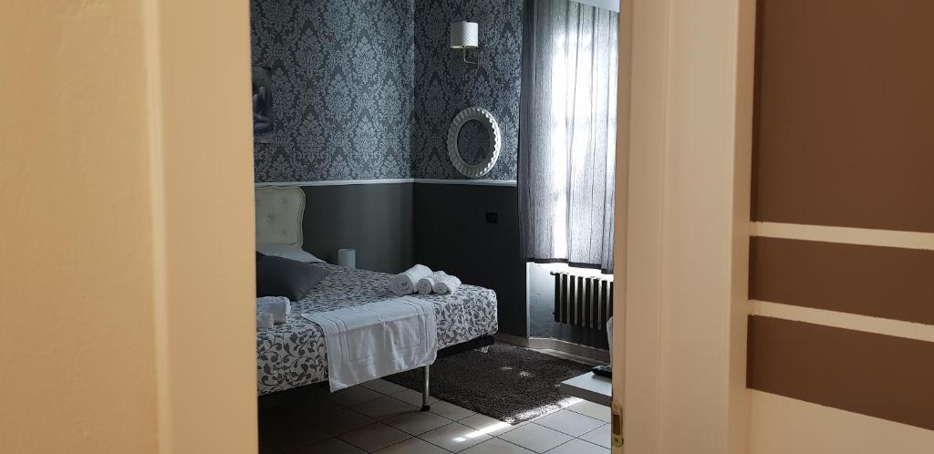 Łóżko lub łóżka w pokoju w obiekcie B&B Villa Rivabella