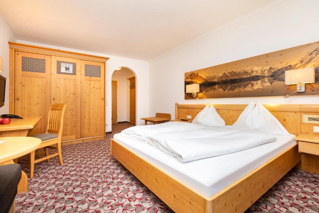 Postel nebo postele na pokoji v ubytování Hotel Pongauerhof