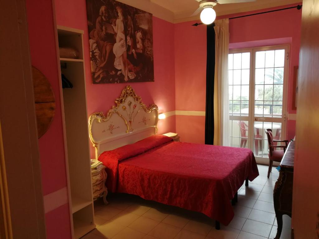 Postel nebo postele na pokoji v ubytování Hotel Biagiotti