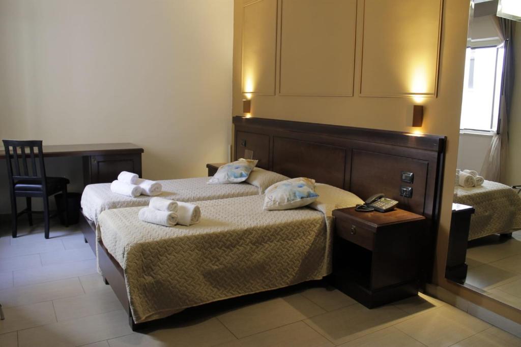 Postel nebo postele na pokoji v ubytování Albanuova Hotel