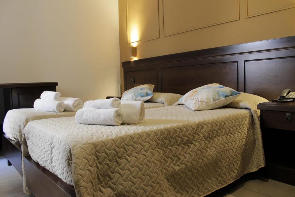 Postel nebo postele na pokoji v ubytování Albanuova Hotel