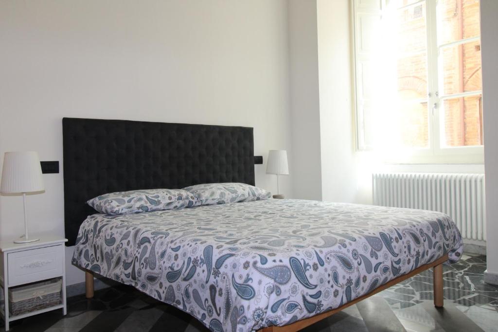 Łóżko lub łóżka w pokoju w obiekcie Luxury Suite apartment Angiolieri