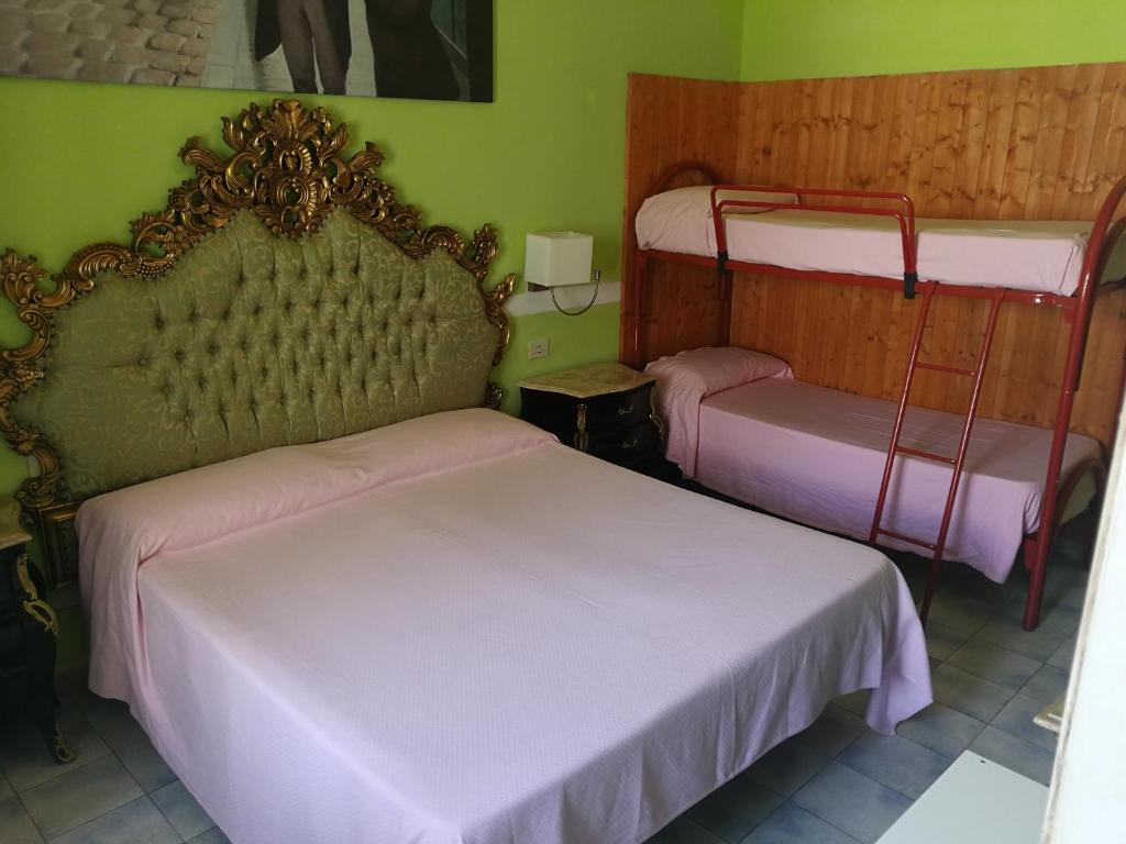 Postel nebo postele na pokoji v ubytování Hotel Biagiotti